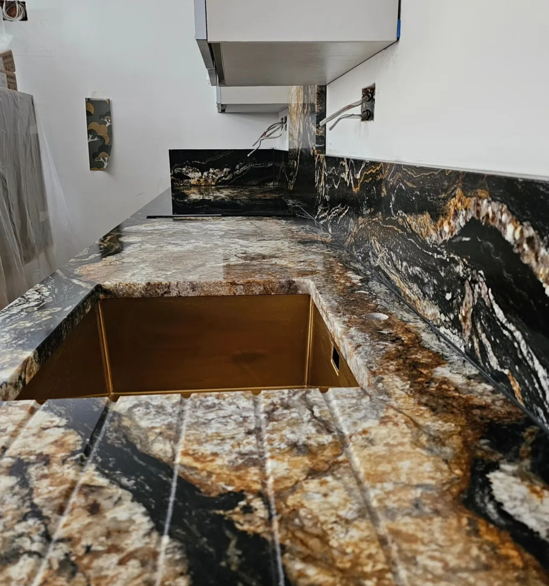 Islington: granite and brass kitchen